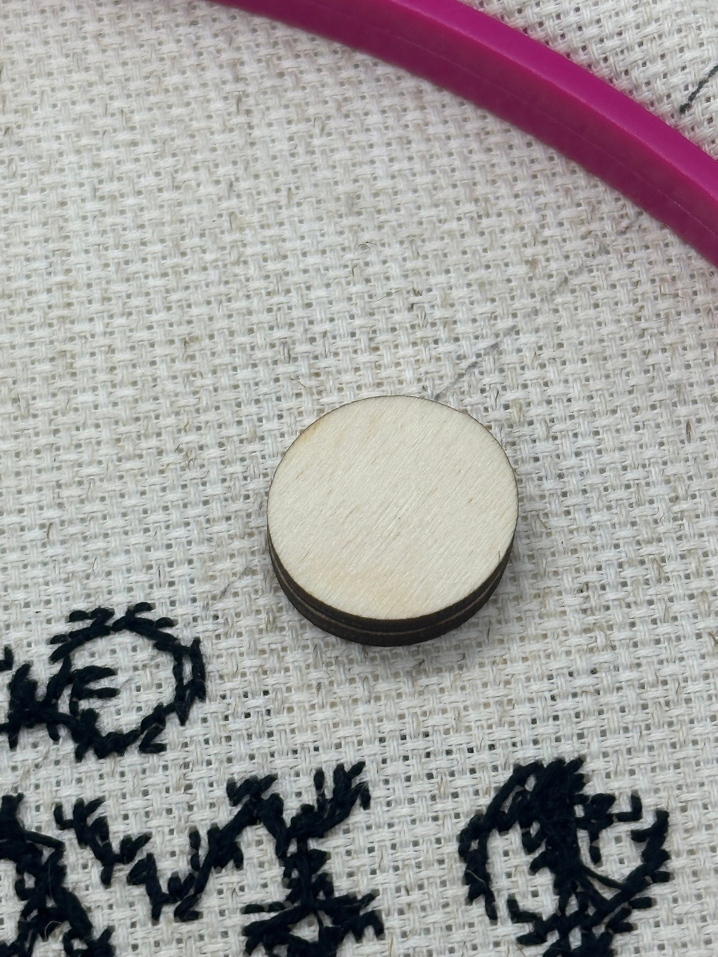 round backing for needle minder on cross stitch project