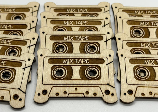 Wooden cutouts of mixtape cassettes on a white background